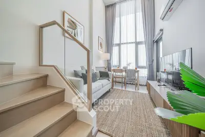 Modern living room with high ceilings and stylish decor