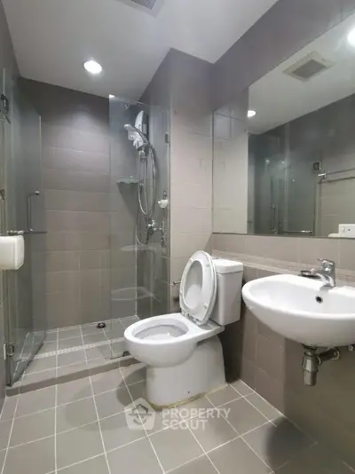 Modern bathroom with glass shower and sleek fixtures