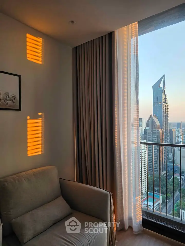 Modern living room with stunning city view and cozy seating area.