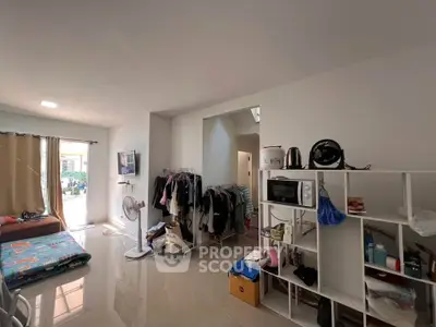 Spacious living area with modern shelving and natural light