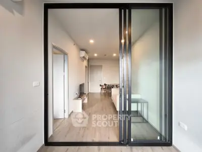 Modern living room with sliding glass doors and sleek interior design