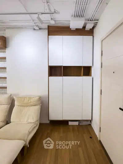 Modern living room with stylish cabinetry and cozy seating area