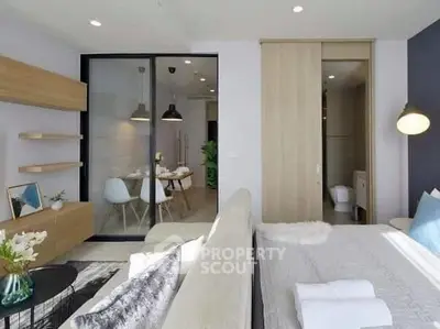 Modern open-plan living room with stylish decor and natural light