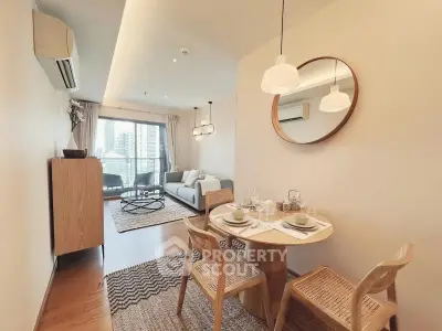 Chic modern living room with dining area and city view balcony