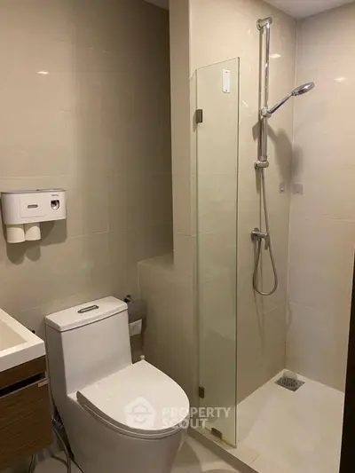 Modern bathroom with sleek shower and toilet design