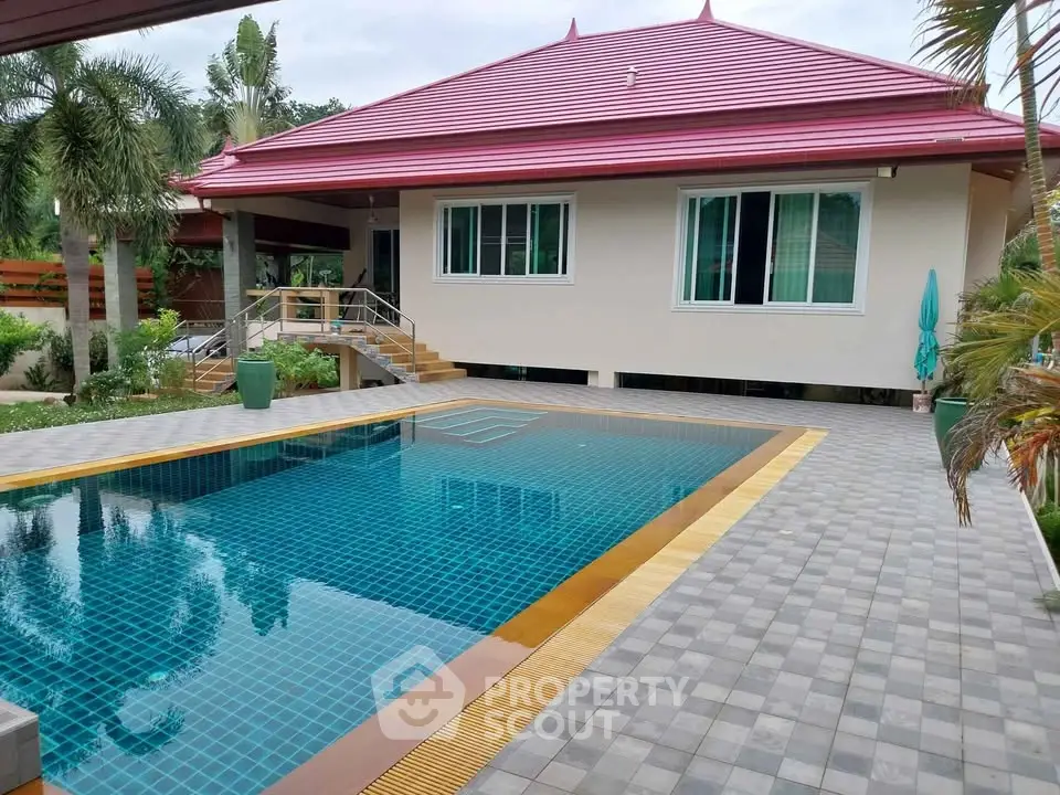 Stunning tropical villa with private pool and lush garden, perfect for luxury living.