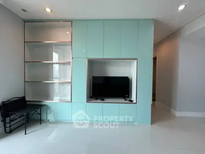 Modern living room with sleek built-in TV unit and minimalist design