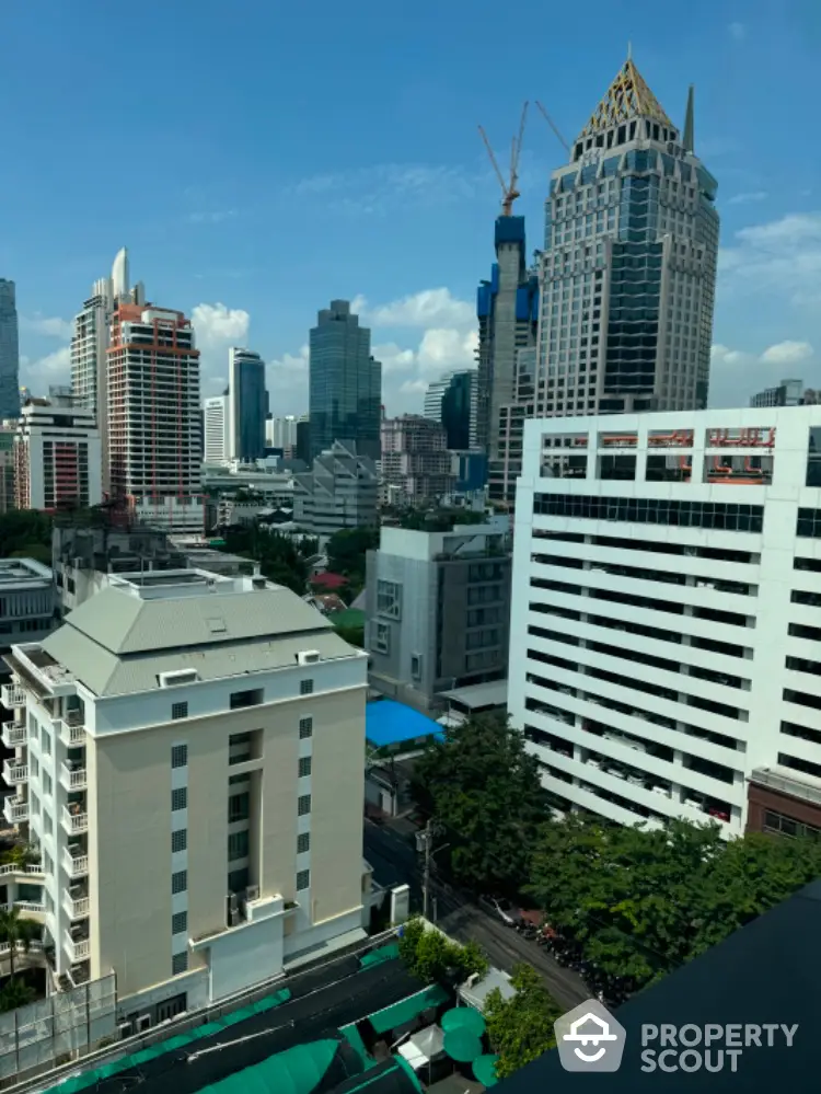 Stunning cityscape view with modern skyscrapers and lush greenery, perfect for urban living.