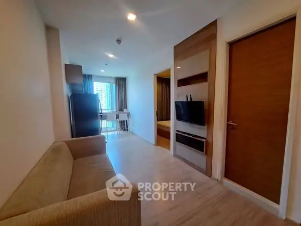 Modern apartment living room with sleek design and natural light