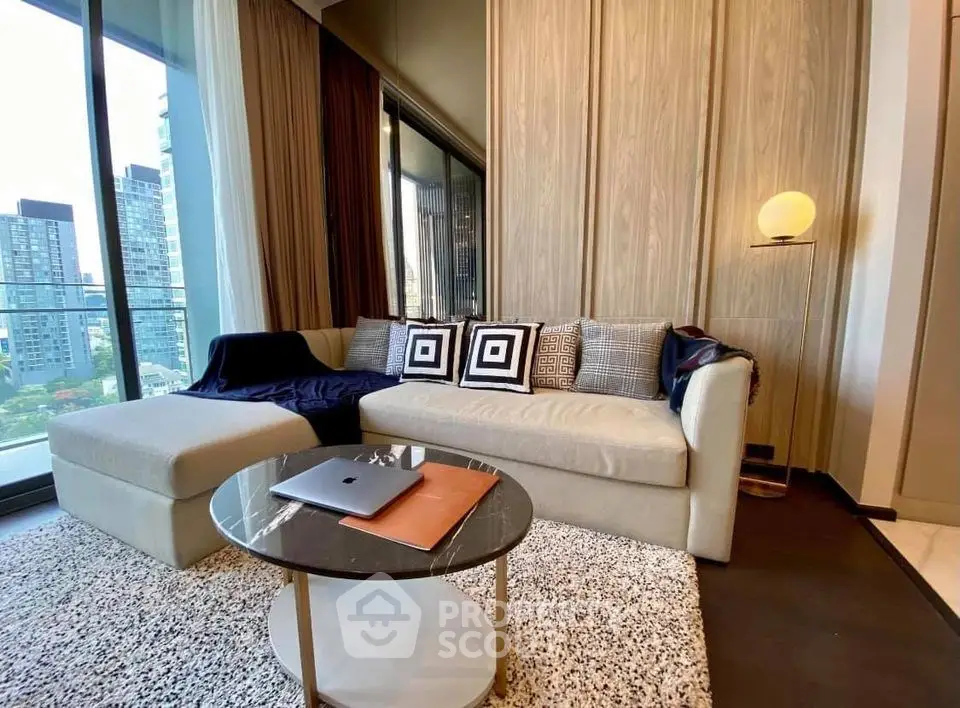 Modern living room with stylish sofa, floor-to-ceiling windows, and city view.