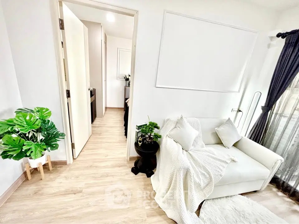 Bright and cozy living room with white sofa and modern decor