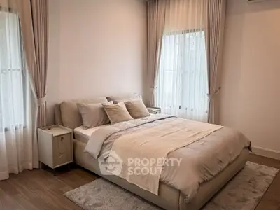 Elegant bedroom with cozy bed and soft lighting, perfect for relaxation and comfort.