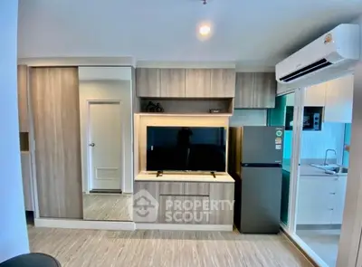 Modern apartment interior with sleek kitchen and built-in storage