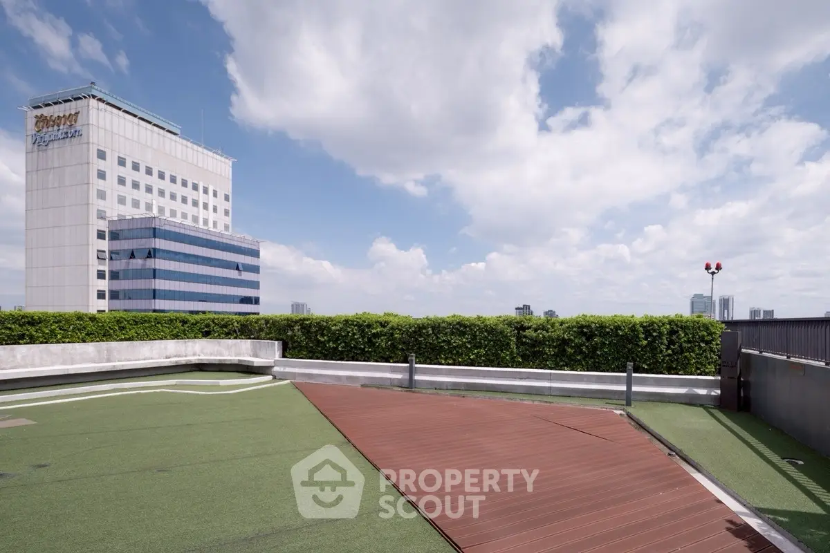 Stunning rooftop view with lush greenery and cityscape backdrop