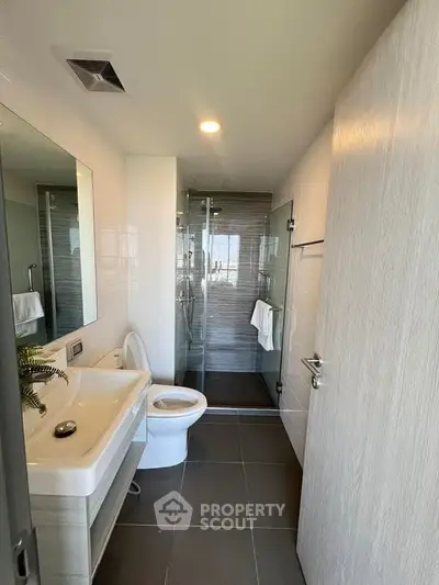 Modern bathroom with sleek design and glass shower enclosure