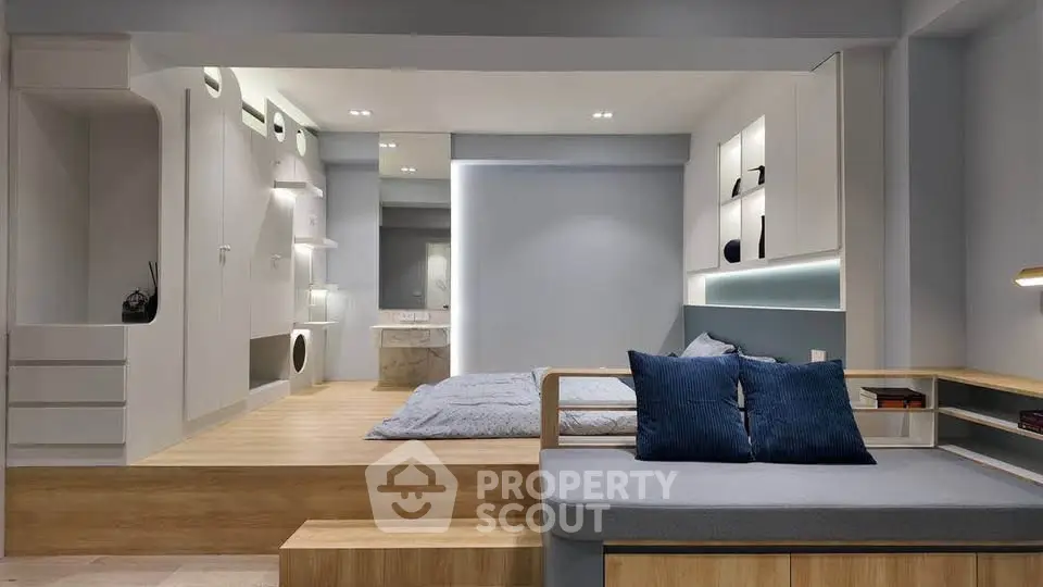 Modern studio apartment with elevated bedroom and stylish living area
