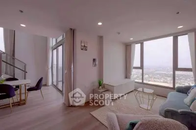 Spacious modern living room with panoramic city view and elegant decor