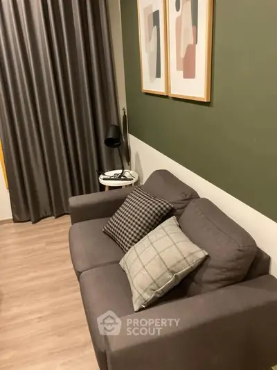 Cozy living room with modern decor and comfortable sofa, perfect for relaxation.