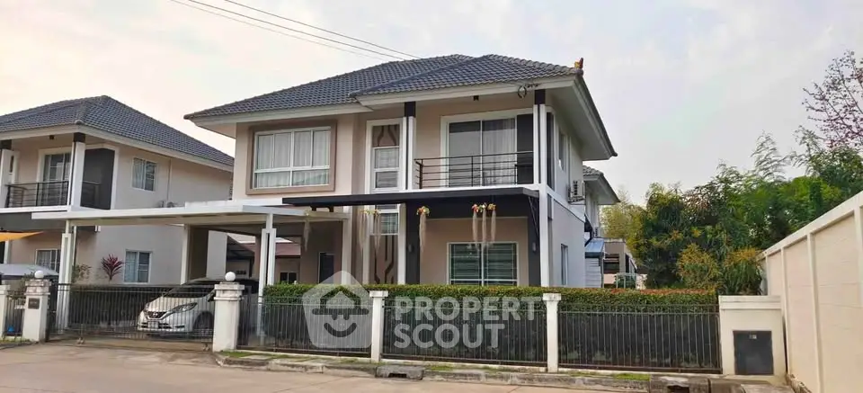 Charming two-story house with modern design and spacious driveway in a serene neighborhood.
