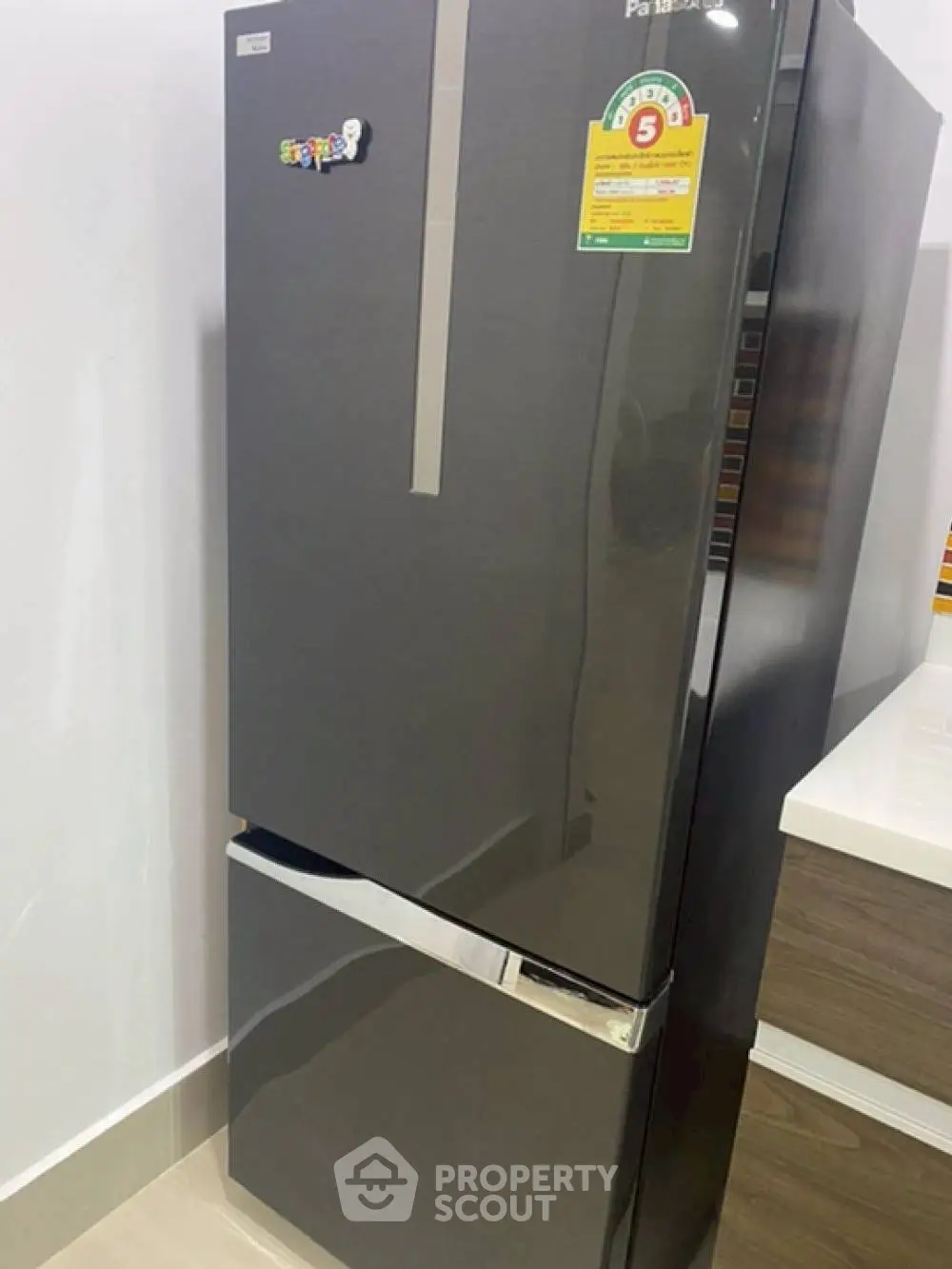 Sleek modern kitchen with energy-efficient stainless steel refrigerator