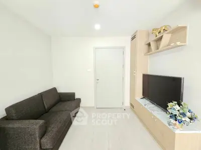 Modern living room with sleek furniture and stylish decor in a contemporary apartment.