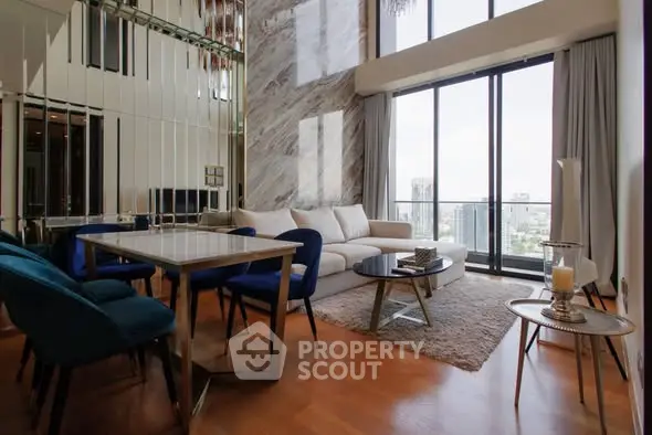 Luxurious living room with floor-to-ceiling windows and modern decor