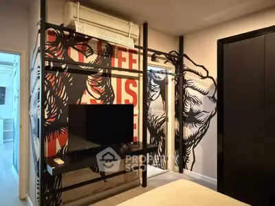 Stylish bedroom with unique wall art and modern TV setup