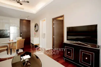 Modern living room with sleek furniture and open kitchen layout