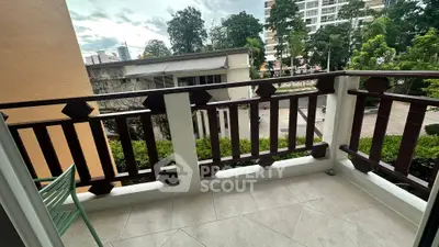 Charming balcony with elegant railing and city view, perfect for relaxation and enjoying the outdoors.