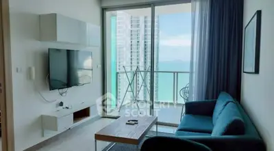 Modern living room with ocean view balcony in high-rise apartment