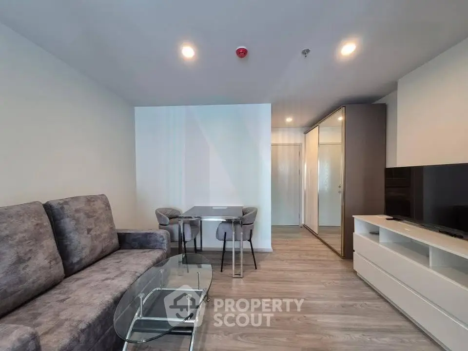 Modern living room with sleek furniture and open layout, perfect for urban living.