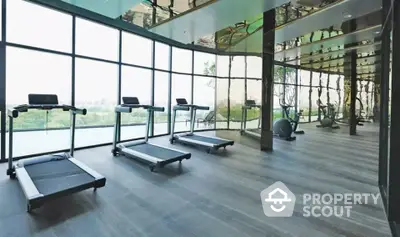 Luxurious gym with panoramic view and modern equipment in upscale property