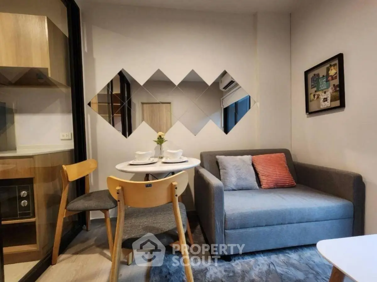 Cozy modern living room with stylish decor and compact dining area