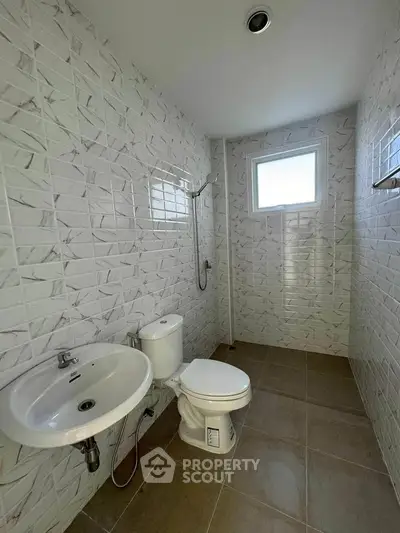 Modern bathroom with sleek tiles and natural light