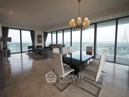 Luxurious corner unit living room with panoramic city views and elegant modern furnishings.