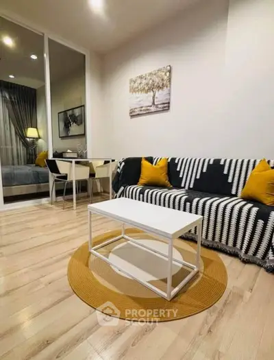Modern living room with stylish decor and cozy seating area, perfect for relaxation and entertaining.
