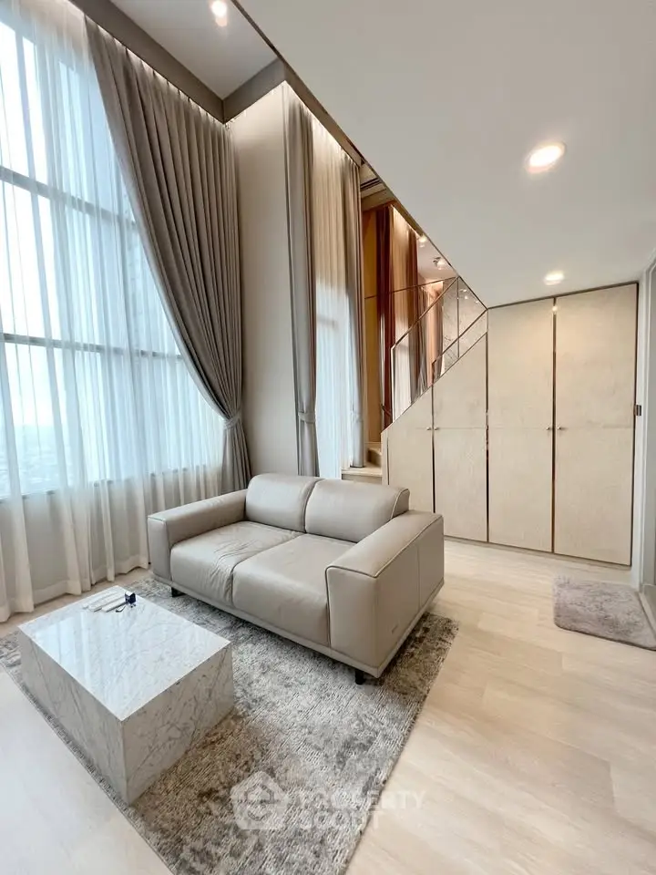 Luxurious modern living room with high ceilings and elegant decor