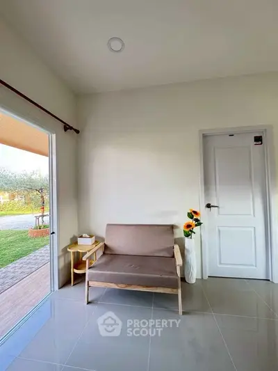 Cozy interior with modern seating and garden view, perfect for relaxation.