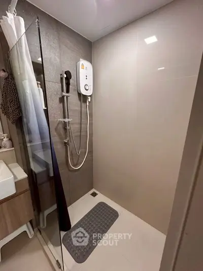 Modern bathroom with sleek shower and contemporary fixtures