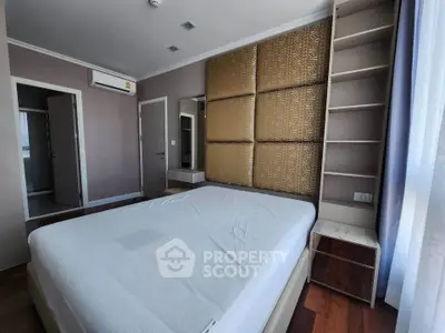 Spacious bedroom with modern decor and ample natural light