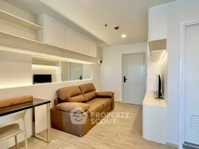 Modern living room with sleek design and comfortable brown sofa in a stylish apartment.
