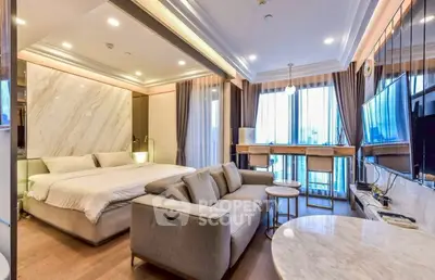 Luxurious modern studio apartment with elegant furnishings and large windows offering natural light.