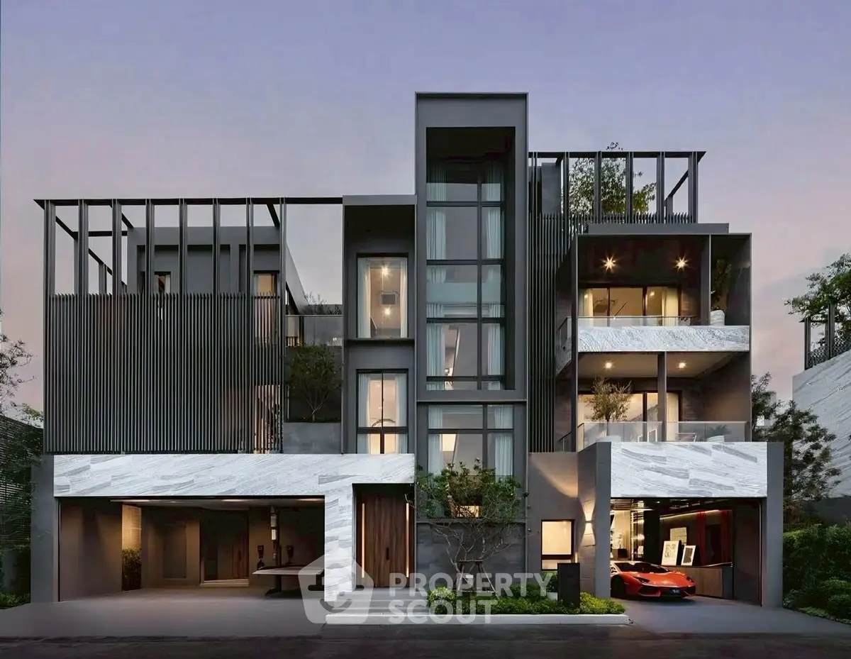Modern luxury home exterior with sleek design and large windows at dusk.