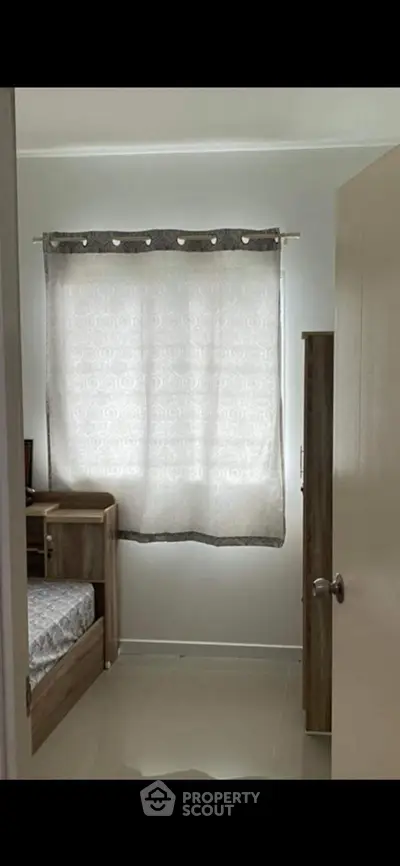 Cozy bedroom with natural light and minimalist decor