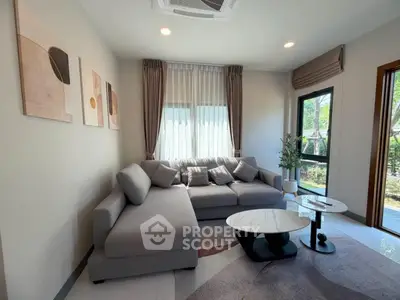 Modern living room with stylish gray sofa and elegant decor