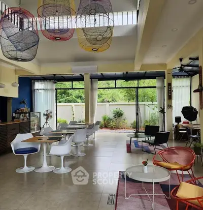 Spacious modern living room with stylish furniture and vibrant decor