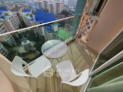 Stunning balcony view with modern chairs and table overlooking cityscape