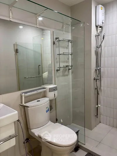 Modern bathroom with glass shower and sleek fixtures