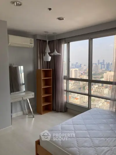 Modern bedroom with city view, large windows, and stylish furnishings in high-rise apartment.