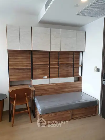 Modern study room with sleek wooden furniture and built-in storage